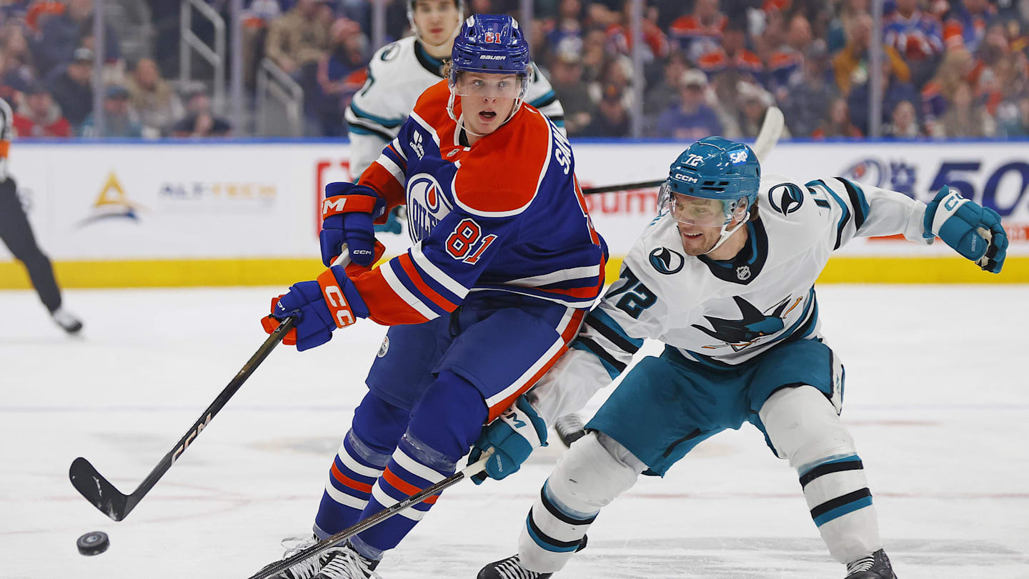 Jan 29, 2026; Edmonton, Alberta, CAN; Edmonton Oilers forward Josh Samanski (81) chips the puck past .San Jose Sharks forward William Eklund (72) during the first period  at Rogers Place. Mandatory Credit: Perry Nelson-Imagn Images