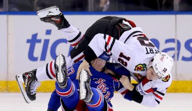 Mar 27, 2026; New York, New York, USA; Chicago Blackhawks center Sacha Boisvert (12) fights with New York Rangers defenseman Will Borgen (17) during the third period at Madison Square Garden. Mandatory Credit: Brad Penner-Imagn Images
