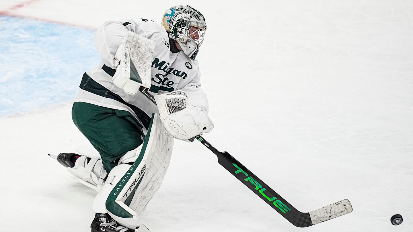 Michigan State goaltender Trey Augustine (1) hits the puck away against Michigan during the second period of Duel in the D at Little Caesars Arena in Detroit on Saturday, February 7, 2026.