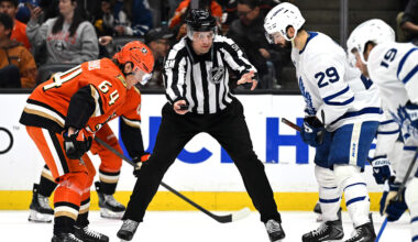 Mar 30, 2026; Anaheim, California, USA; Anaheim Ducks center Mikael Granlund (64), linesman Ryan Gibbons (58) and Toronto Maple Leafs center Bo Groulx (29) during a face off during the second period at Honda Center. Mandatory Credit: Griffin Hooper-Imagn Images