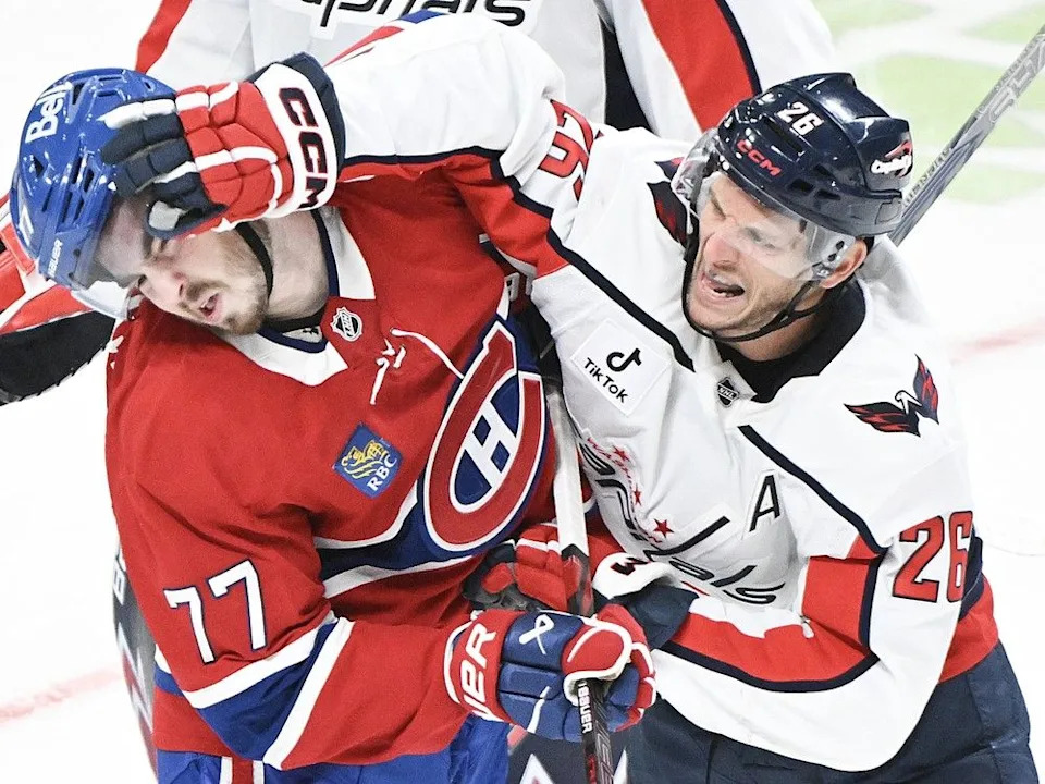  Washington Capitals’ Nic Dowd (26) tries to face wash Canadiens’ Kirby Dach in Montreal on Saturday, Feb. 28, 2026.