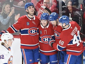 Montreal Canadiens players celebrate a goal