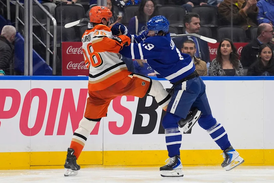Toronto Maple Leafs forward Calle Jarnkrok (19) checks Anaheim Ducks defenseman Pavel Mintyukov (98) during the third period at Scotiabank Arena. 