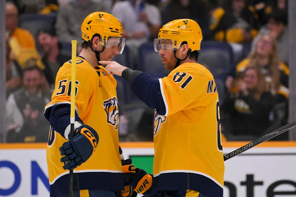 Mar 5, 2026; Nashville, Tennessee, USA; Nashville Predators left wing Erik Haula (56) and center Jonathan Marchessault (81) talk just before the face off against the Boston Bruins during the third period at Bridgestone Arena. Mandatory Credit: Steve Roberts-Imagn Images