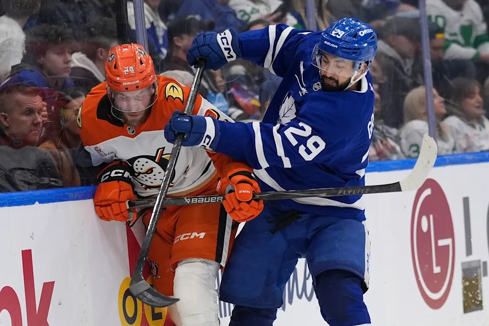 Toronto Maple Leafs forward Benoit-Olivier Groulx (29) checks Anaheim Ducks forward Jansen Harkins (24) along the boards during the third period at Scotiabank Arena. 