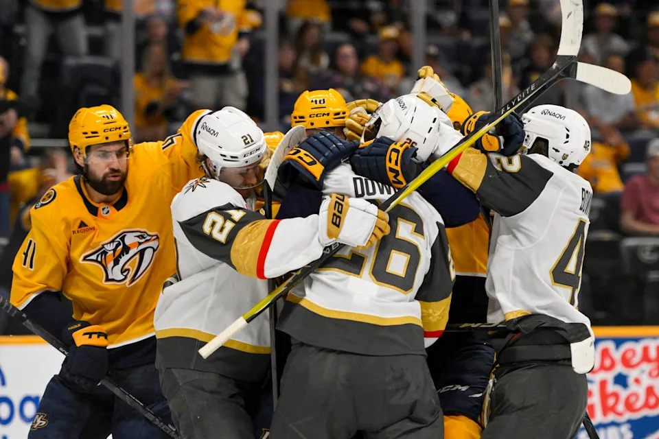 Mar 21, 2026; Nashville, Tennessee, USA; Nashville Predators and Vegas Golden Knights players push and shove each other during the third period at Bridgestone Arena. Mandatory Credit: Steve Roberts-Imagn Images