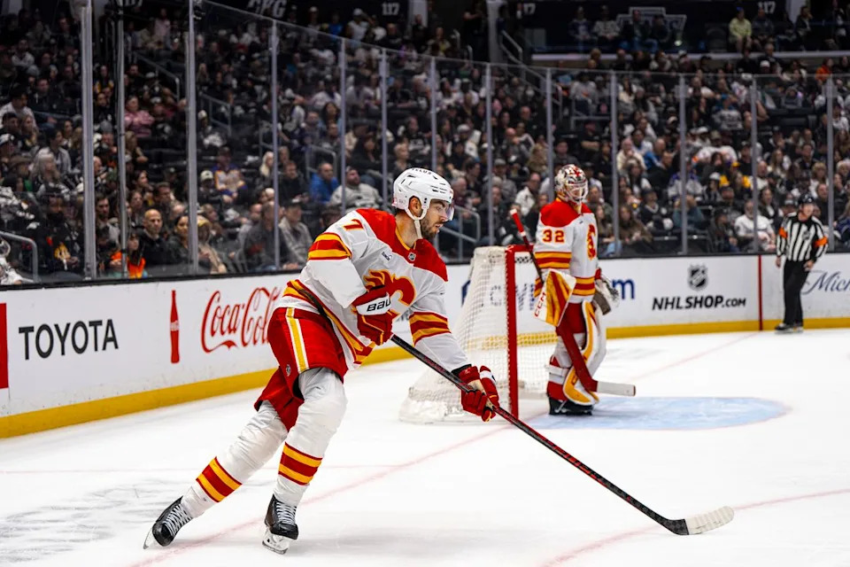 Calgary Flames defenseman Kevin Bahl (7) moving the puck away from Calgary's net during an NHL hockey game against the Los Angeles Kings on February 26th, 2026 in Los Angeles, CA.