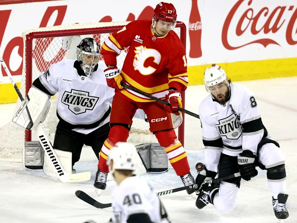  Yegor Sharangovich battles Kings defenceman Drew Doughty.