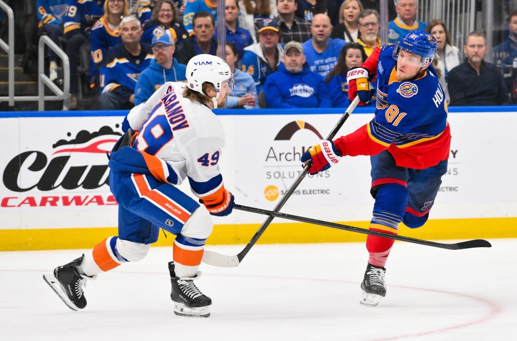 Dylan Holloway shoots and scores as Max Shabanov defends during the Islanders’ win overt the Blues on March 10, 2026. Jeff Curry-Imagn Images