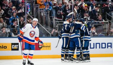 Alex, Knox, Xander and Jaxson Mick of Mt. Vernon, Ohio take photos with Columbus Blue Jackets defenseman Zach Werenski's Team USA Olympic gold medal prior to the NHL hockey game against the New York Islanders at Nationwide Arena in Columbus on Feb. 28, 2026.