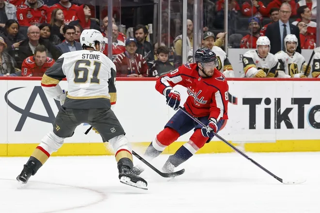 Feb 27, 2026; Washington, District of Columbia, USA; Washington Capitals left wing Pierre-Luc Dubois (80) skates with the puck as Vegas Golden Knights right wing Mark Stone (61) defends during the third period at Capital One Arena.