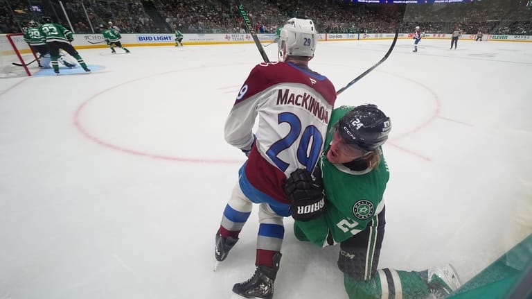 Colorado Avalanche center Nathan MacKinnon (29) and Dallas Stars center...