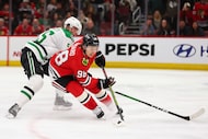 Chicago Blackhawks center Connor Bedard controls the puck against Dallas Stars defenseman...