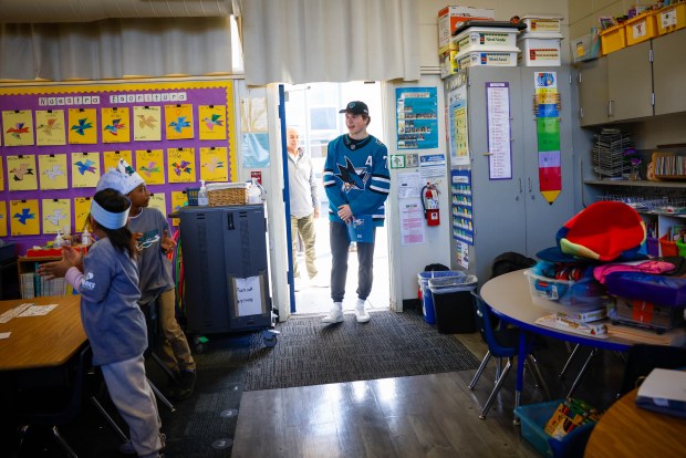 San Jose Sharks' Macklin Celebrini enters a classroom to read to children at Bachrodt Elementary in San Jose, Calif., on Thursday, March 5, 2026. (Shae Hammond/Bay Area News Group)
