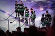 Dallas Stars defenseman Tyler Myers (57) stands for the national anthem alongside fellow...