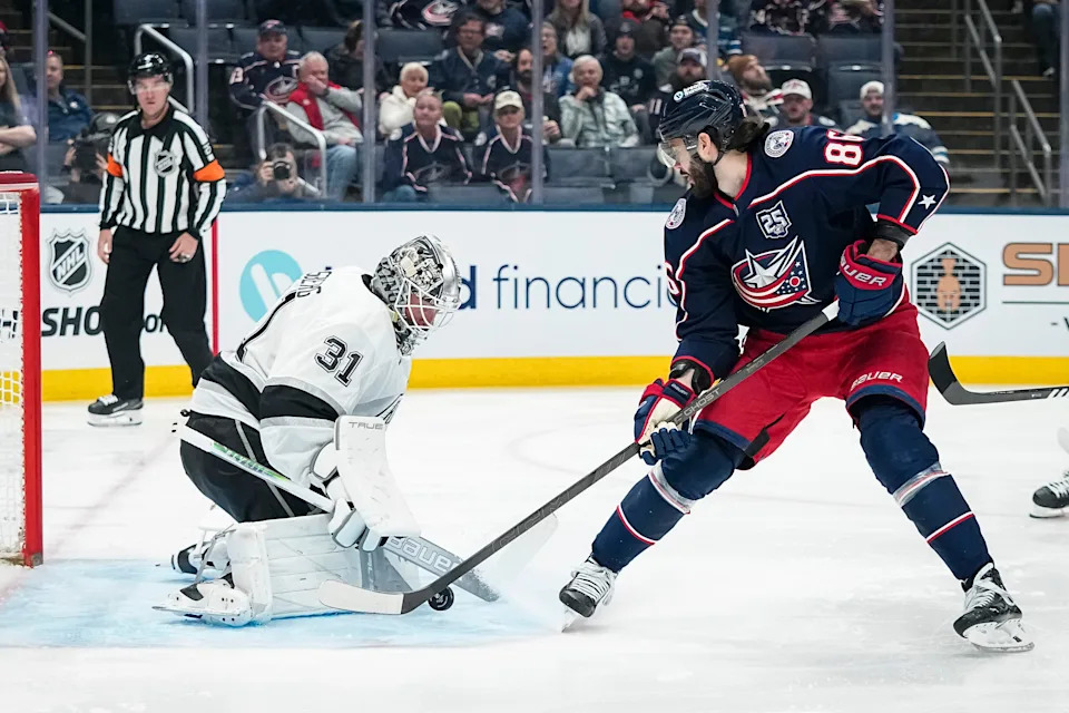 Los Angeles Kings goaltender Anton Forsberg (31) saves a shot from Columbus Blue Jackets right wing Kirill Marchenko (86) during the first period of the NHL hockey game at Nationwide Arena in Columbus on March 9, 2026.