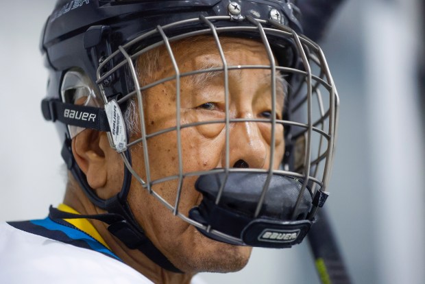 Ed Asato (3), 87, from Sunnyvale, waits on the bench for his rotation during his game in the "Over 60 Division" of the Master's League at Sharks Ice in San Jose, Calif., on Monday, Nov. 17, 2025. (Nhat V. Meyer/Bay Area News Group)