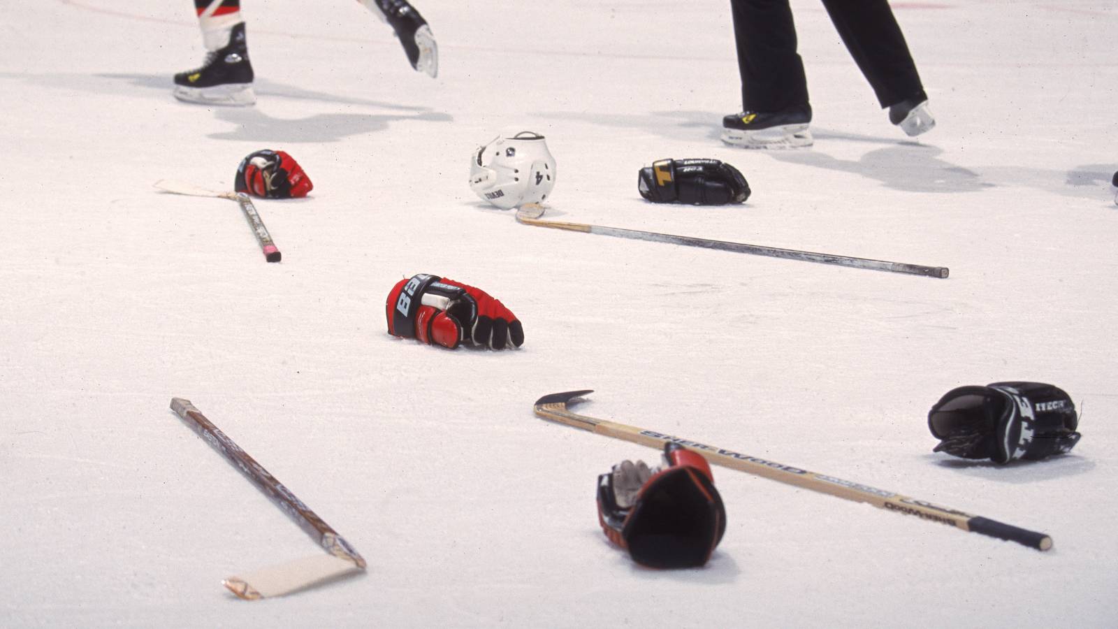 Hockey equipment on ice after fight
