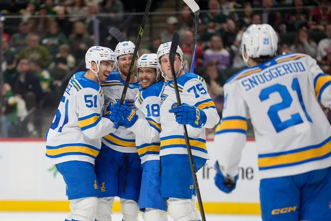 Mar 1, 2026; Saint Paul, Minnesota, USA; St. Louis Blues left wing Pavel Buchnevich (89) celebrates with teammates after scoring against Minnesota Wild in the third period at Grand Casino Arena.