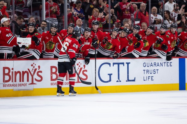 Chicago Blackhawks left wing Andrew Mangiapane (26) high fives his teammates in the first period against the Mammoth on Monday, March, 9, 2026, at the United Center. (Josh Boland/Chicago Tribune)