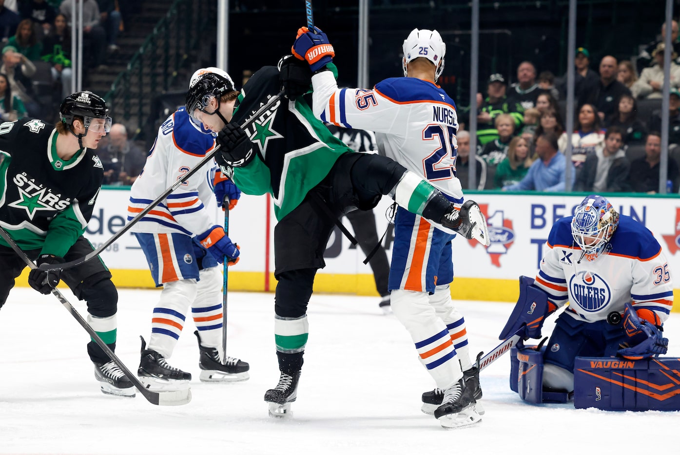 Dallas Stars right wing Arttu Hyry (25) is hit by Edmonton Oilers defenseman Darnell Nurse...
