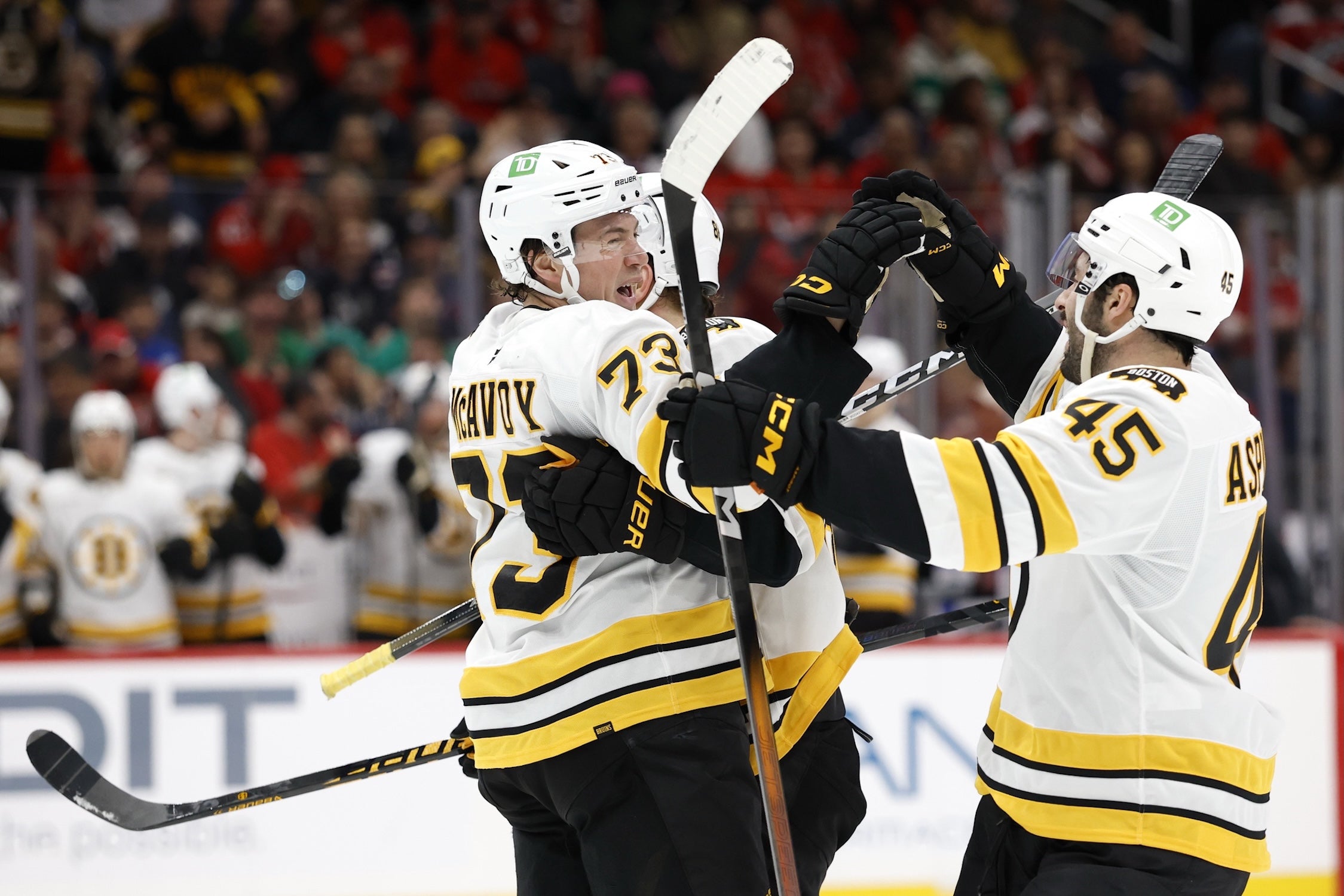 Mar 9, 2026; Washington, District of Columbia, USA; Boston Bruins defenseman Charlie McAvoy (73) celebrates with teammates after scoring a goal against the Washington Capitals during the second period at Capital One Arena. Mandatory Credit: Geoff Burke-Imagn Images