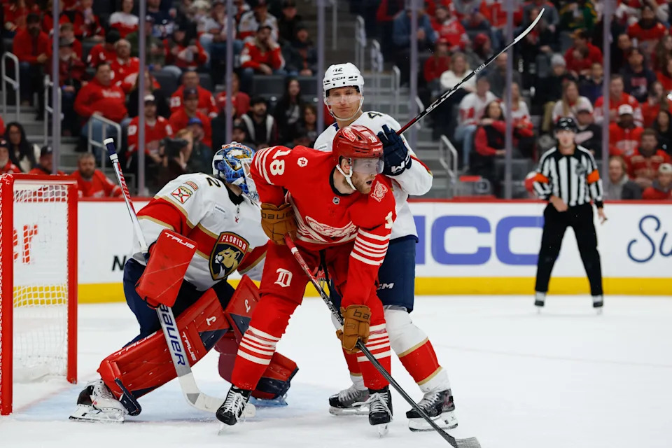 Detroit Red Wings center Andrew Copp (18) and Florida Panthers defenseman Gustav Forsling (42) fight for position in front of goaltender Sergei Bobrovsky (72) in the second period at Little Caesars Arena in Detroit on Friday March 6, 2026.