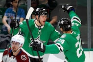 Dallas Stars right wing Mikko Rantanen (96) celebrates his goal with center Roope Hintz (24)...