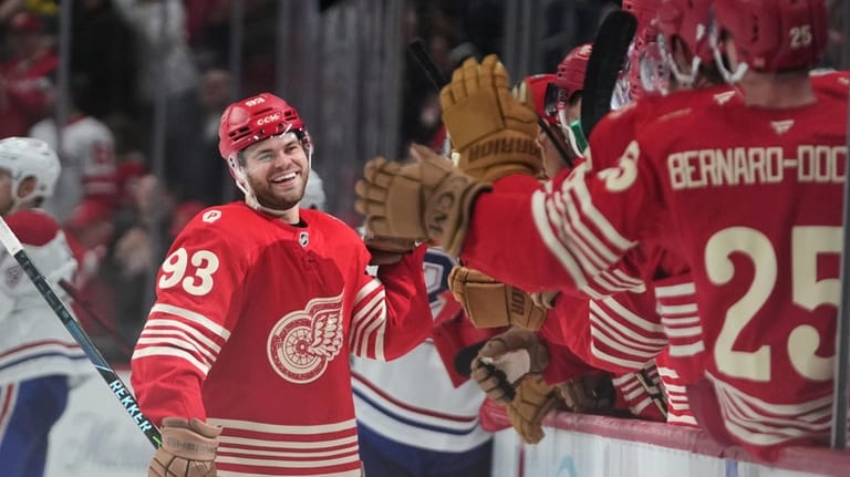 Detroit Red Wings right wing Alex DeBrincat (93) celebrates his...