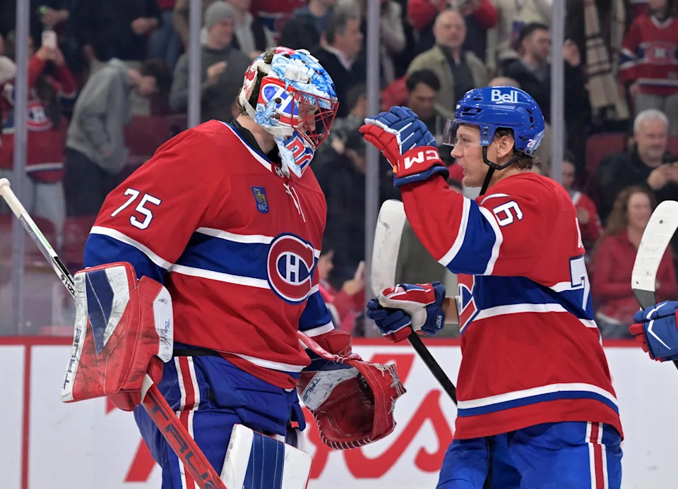 Montreal Canadiens goalie Jakub Dobes (75) celebrates the win against the Columbus Blue Jackets with teammate forward Zack Bolduc (76) at the Bell Centre.