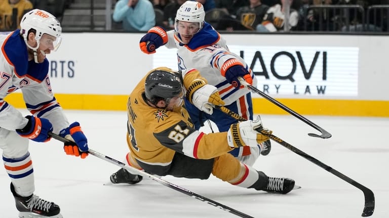 Edmonton Oilers left wing Zach Hyman (18) holds Vegas Golden...