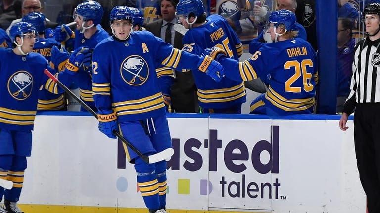 Buffalo Sabres center Tage Thompson (72) celebrates with defenseman Rasmus...