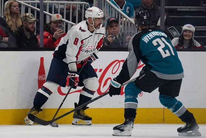 Dec 3, 2025; San Jose, California, USA; Washington Capitals left winger Alex Ovechkin (8) looks to pass against San Jose Sharks center Alexander Wennberg (21) in the second period at SAP Center in San Jose.