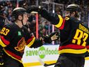 Marco Rossi (left) is congratulated by Liam Ohgren after scoring a goal against the Florida Panthers earlier this month