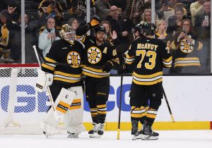 BOSTON, MASSACHUSETTS - MARCH 19: Jeremy Swayman #1 of the Boston Bruins celebrates a win against the Winnipeg Jets with teammate David Pastrnak #88 at the TD Garden on March 19, 2026 in Boston, Massachusetts. The Bruins won 6-1. (Photo by Rich Gagnon/Getty Images)