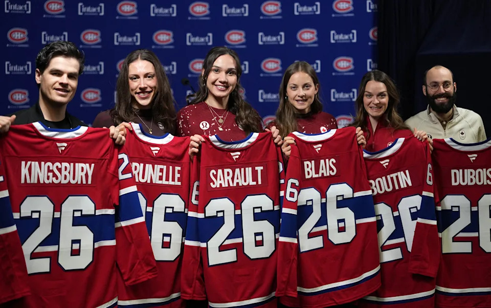 Feb 28, 2026; Montreal, Quebec, CAN; Canadian medalists from the Milano-Cortina Olympic Games Mikael Kingsbury, Florence Brunelle and Courtney Sarault and Danae Blais and Kim Boutin and Steven Dubois receive a Canadiens jersey before the game between the Washington Capitals and the Montreal Canadiens at the Bell Centre. Mandatory Credit: Eric Bolte-Imagn Images