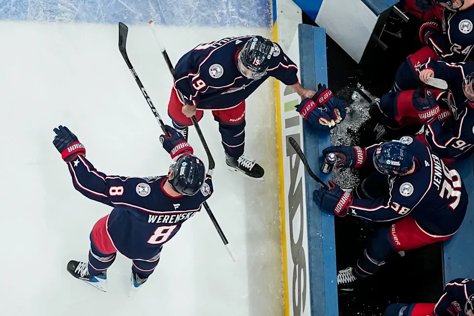 Columbus Blue Jackets defenseman Zach Werenski (8) talks to Columbus Blue Jackets center Adam Fantilli (19) during the NHL hockey game against the Calgary Flames at Nationwide Arena in Columbus on Jan. 13, 2026. The blue jackets won 5-3.