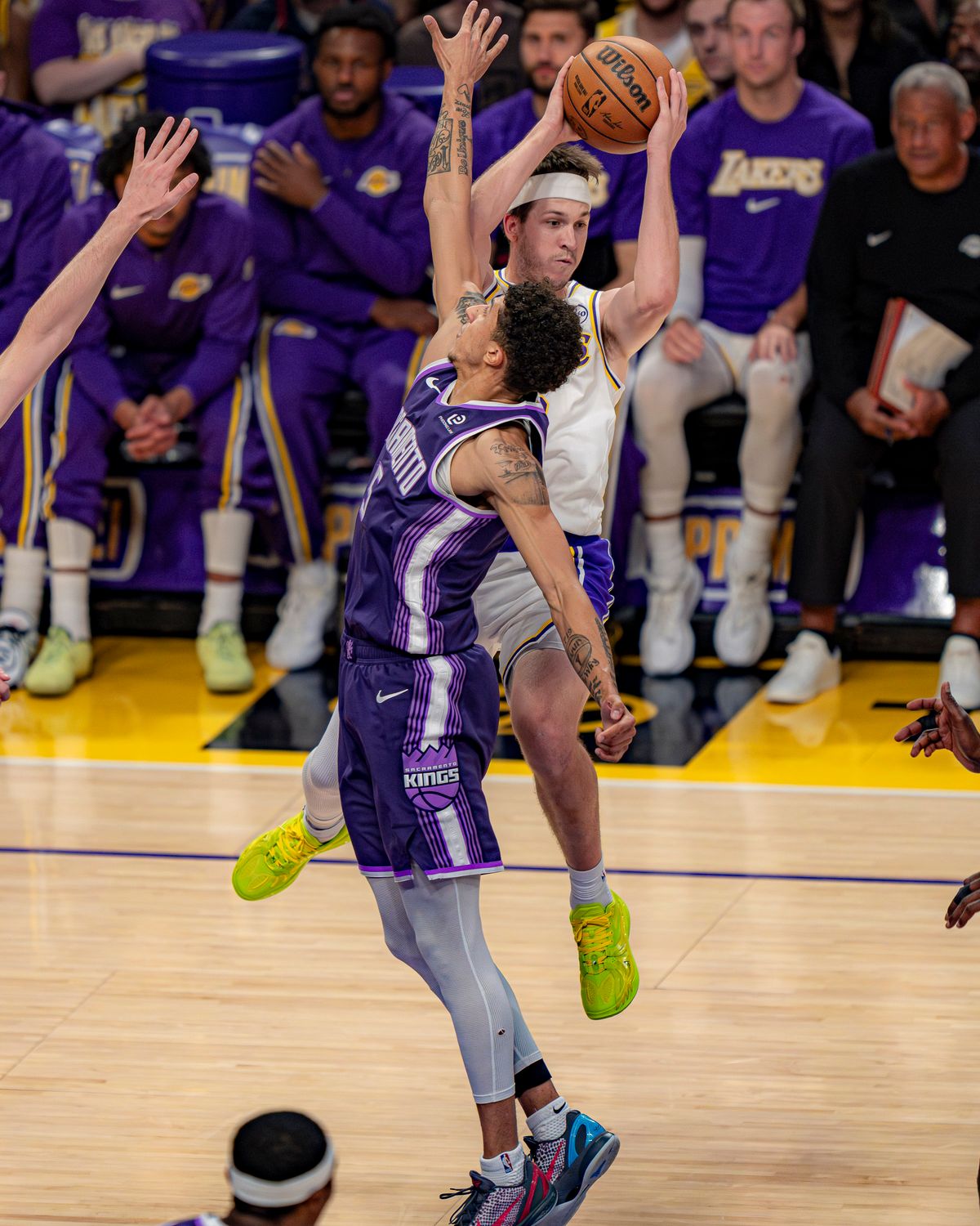 Los Angeles Lakers guard Austin Reeves (15) passing the ball to a teammate during an NBA basketball game against the Sacramento Kings on March 1st, 2026 in Los Angeles, CA.