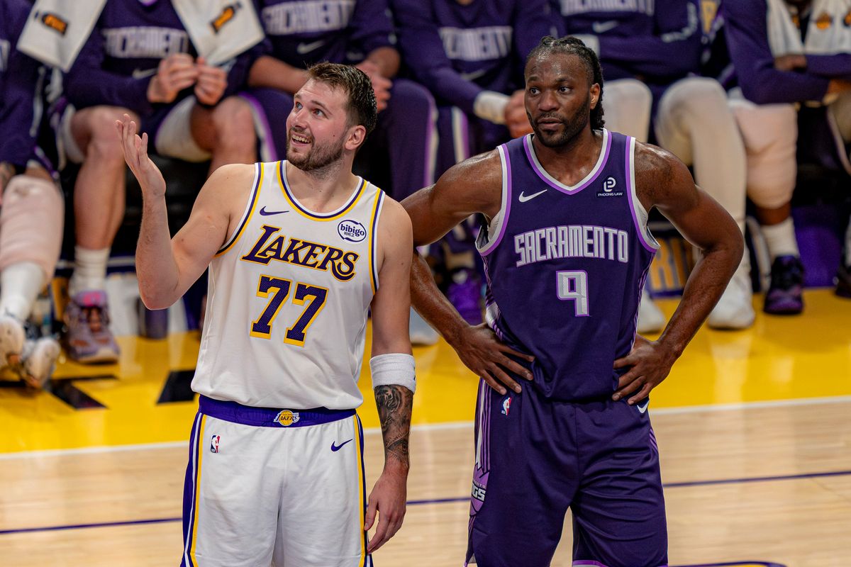 Los Angeles Lakers guard Luka Doncic (77) laughing with Precious Achiuwa (9) during an NBA basketball game against the Sacramento Kings on March 1st, 2026 in Los Angeles, CA.