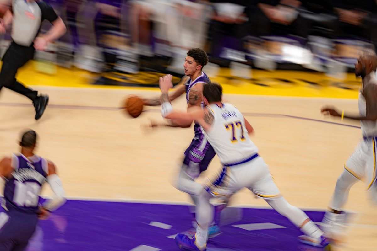 Sacramento Kings guard Nique Clifford (5) running past Luka Doncic during an NBA basketball game against the Los Angeles Lakers on March 1st, 2026 in Los Angeles, CA.