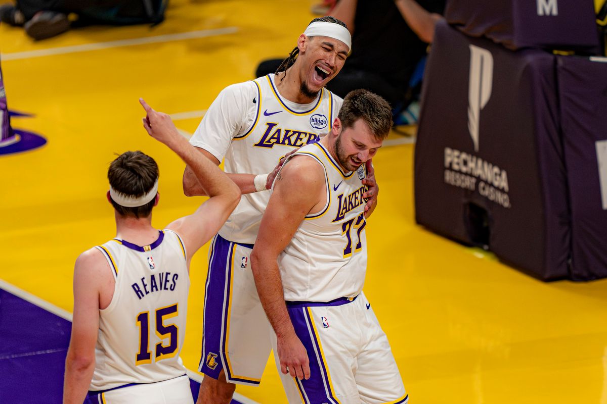 Los Angeles Lakers guard Luka Doncic (77) being celebrated by teammates during an NBA basketball game against the Sacramento Kings on March 1st, 2026 in Los Angeles, CA.