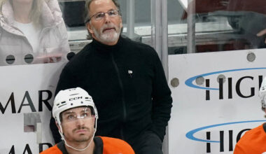 Philadelphia Flyers head coach John Tortorella stands behind his bench during the first period ...