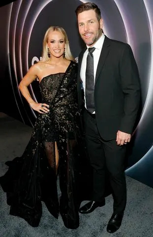 Carrie Underwood and Mike Fisher in March 2025 in NashvilleCredit: Jason Kempin/Getty