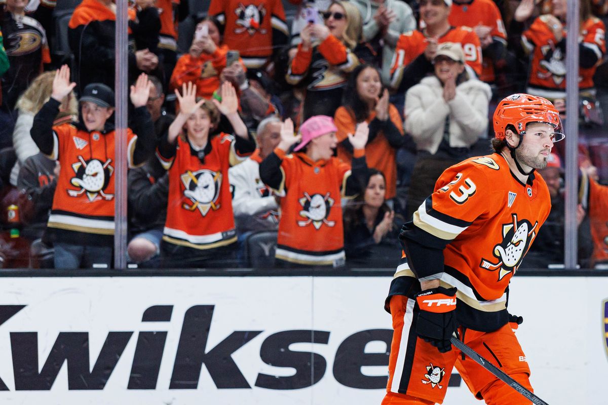 Anaheim Ducks center Mason McTavish (23) skates to the bench after scoring a game-winning shootout goal during an NHL match against the Calgary Flames on March 1, 2026 in Anaheim, California.