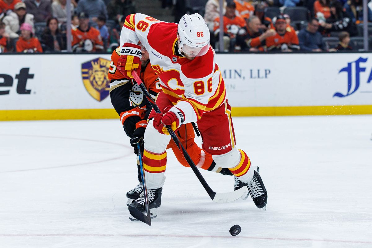 Calgary Flames left wing Joel Farabee (86) defends the puck during an NHL match against the Anaheim Ducks on March 1, 2026 in Anaheim, California.