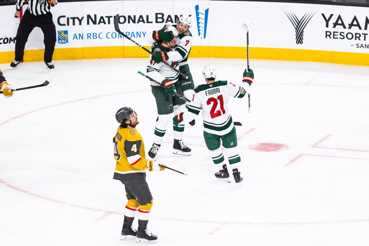 Minnesota Wild defenseman Brock Faber (7) jumps on center Michael McCarron (47) after a Wild goal during a NHL game between the Vegas Golden Knights and the Minnesota Wild, Friday March 6, 2026 in Las Vegas, Nev.