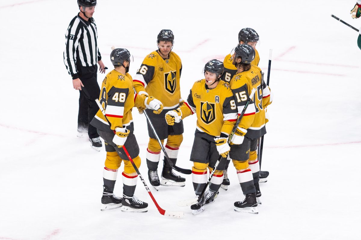Vegas Golden Knights players give each other fist bumps after a goal during a NHL game between the Vegas Golden Knights and the Minnesota Wild, Friday March 6, 2026 in Las Vegas, Nev.