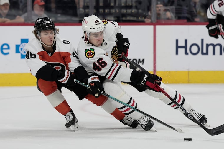 Flyers # 46 Trevor Zegras pokes the puck from Chicago’s # 46 Louis Crevier during the Chicago Blackhawks vs. Philadelphia Flyers NHL game at Xfinity Mobile Arena in Philadelphia on Thursday, March 26, 2026.
