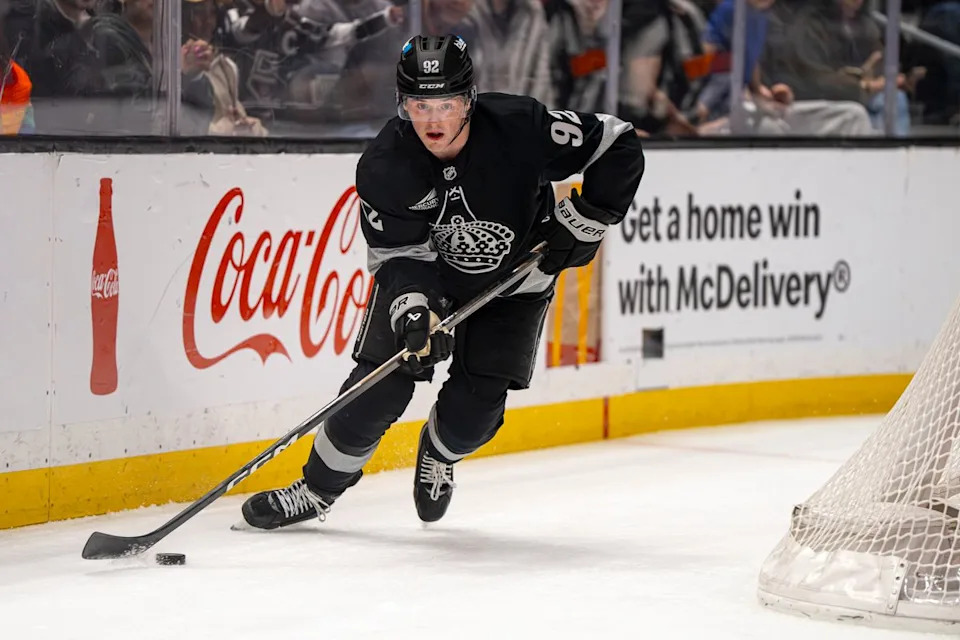 Los Angeles Kings defenseman Brandt Clarke (92) moving the puck into striking position during an NHL hockey game against the Calgary Flames on February 26th, 2026 in Los Angeles, CA.