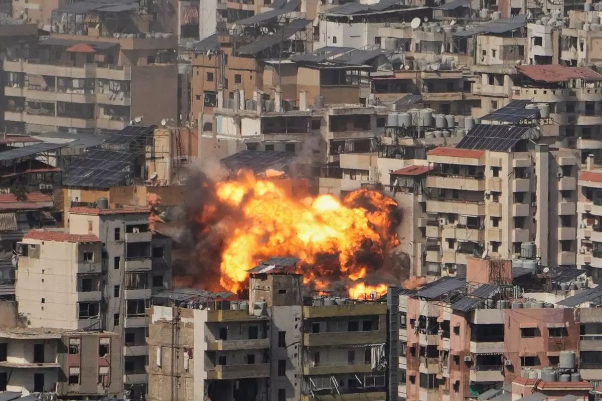 Flames rise from an Israeli airstrike in Dahiyeh, Beirut's southern suburbs, Wednesday, March 11, 2026. (AP Photo/Hassan Ammar)